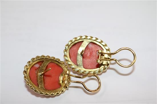 A pair of yellow metal and fluted coral oval earrings, 24mm.
